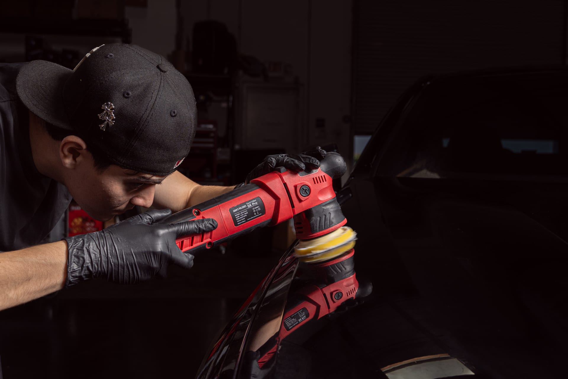 Adam performing paint correction with a dual-action polisher